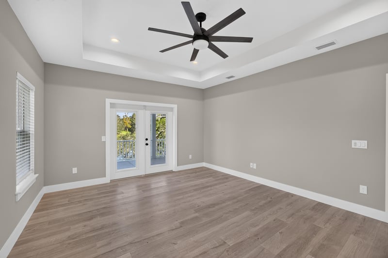 Dining room with tray ceiling and windows at 175 Alava Ct
