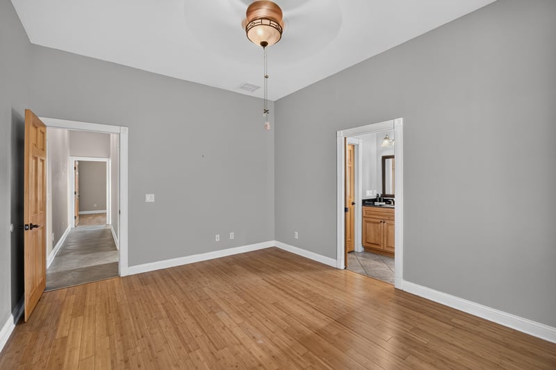 Hallway with hardwood floors and doors at 1735 Hagans Ridge Ct