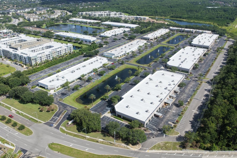 Aerial view of office buildings and parking lots at 10550 Deerwood Park Blvd, Jacksonville, FL 32256