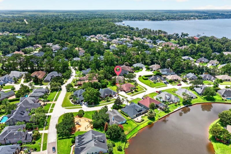 Aerial view of neighborhood and pond in Fleming Island, FL