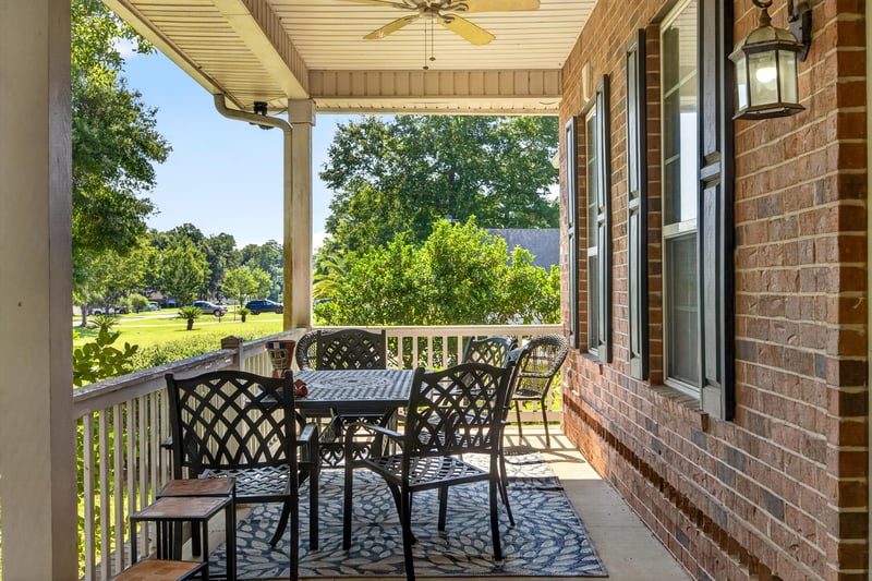 Front porch view of the lawn and trees at 1735 Hagans Ridge Ct