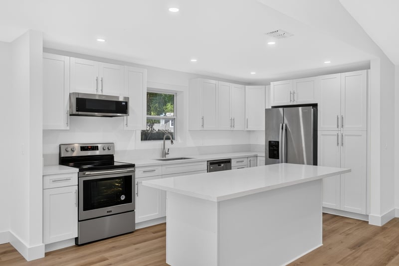 Kitchen with stainless refrigerator and center island at 8453 Boysenberry Ln W, Jacksonville, FL