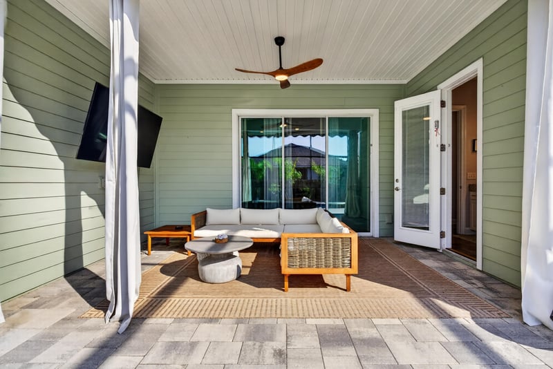 Covered patio seating area at 3328 Southern Oaks Dr, Green Cove Springs, FL 32043