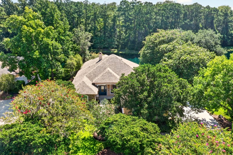 Aerial of the home set among mature oaks at 11675 Magnolia Estates Rd, Jacksonville, FL 32223