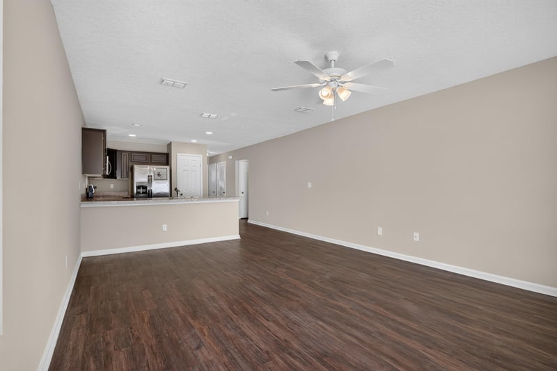 Open living area leading toward kitchen at 7253 Townsend Village Ct, Jacksonville, FL