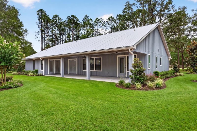 Side exterior with covered porch at 4800 Acacia St, Middleburg, FL 32068