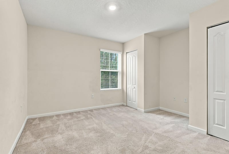 Empty room with carpet and window at 9555 Star Dr, Jacksonville, FL 32256