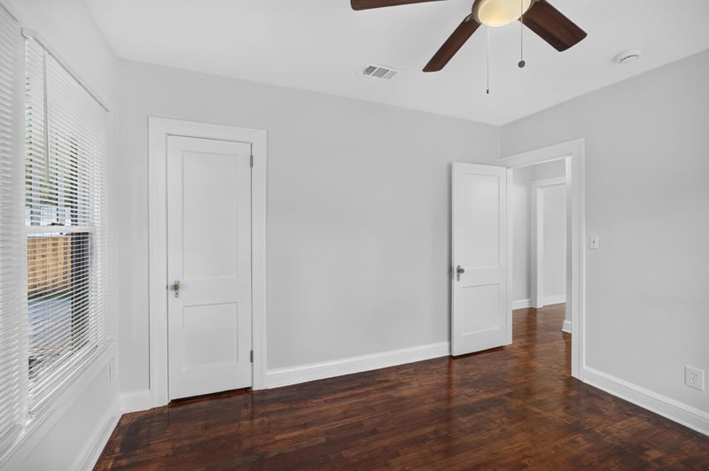 Bedroom with multiple doors and hardwood floors at 316 W 41st St, Jacksonville, FL 32206