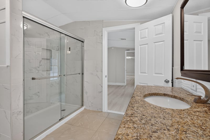 Bathroom glass shower and tile surround at 4565 Appleton Ave, Jacksonville, FL