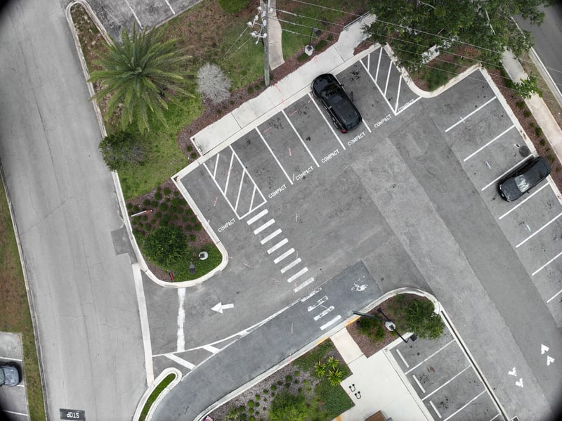 Aerial view of parking lot and landscaped corner at 9406 Atlantic Blvd, Jacksonville, FL 32225
