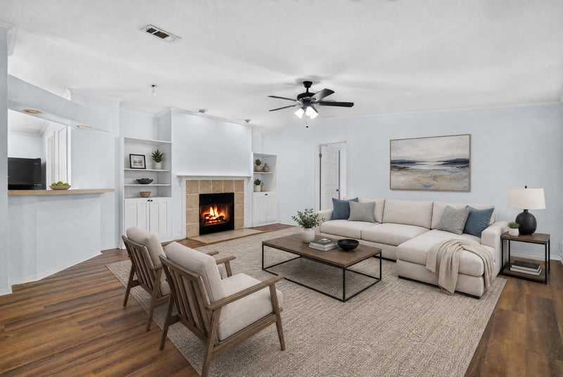 Living room with fireplace and virtually staged seating at 3215 Robin Ln, Middleburg, FL