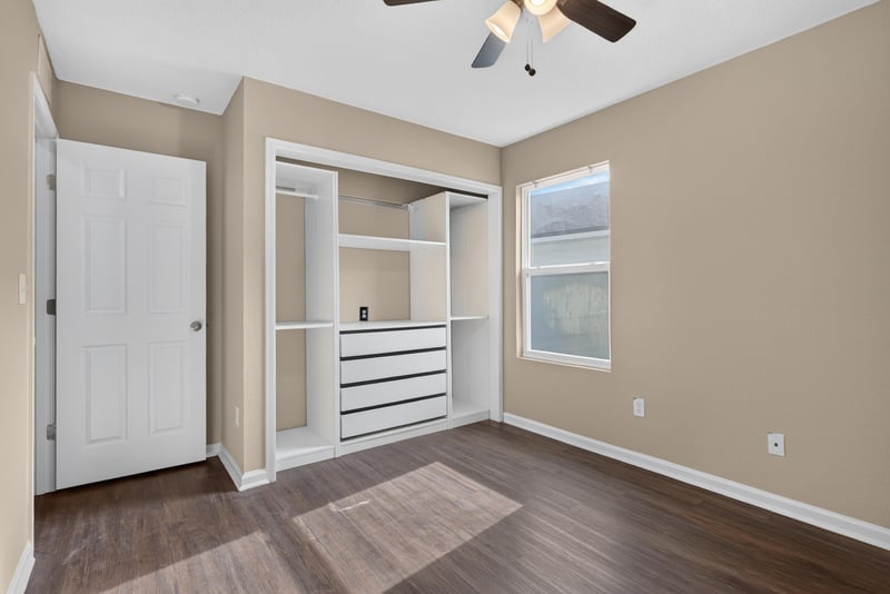 Closet with built-in drawers and shelving at 7253 Townsend Village Ct, Jacksonville, FL