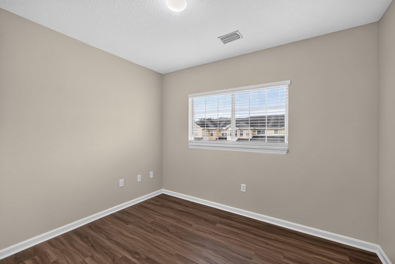 Bedroom with window at 3750 Silver Bluff Blvd, Orange Park, FL