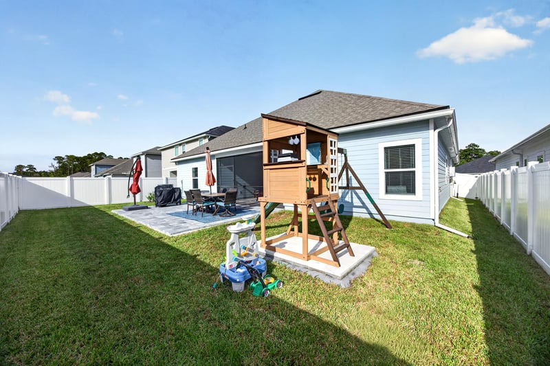Backyard with play set and privacy fence at 2354 Jennings Farm Dr, Middleburg, FL 32068