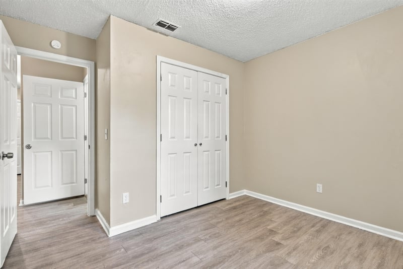 Empty bedroom with closet doors at 219 Shortreed St, Jacksonville, FL 32254