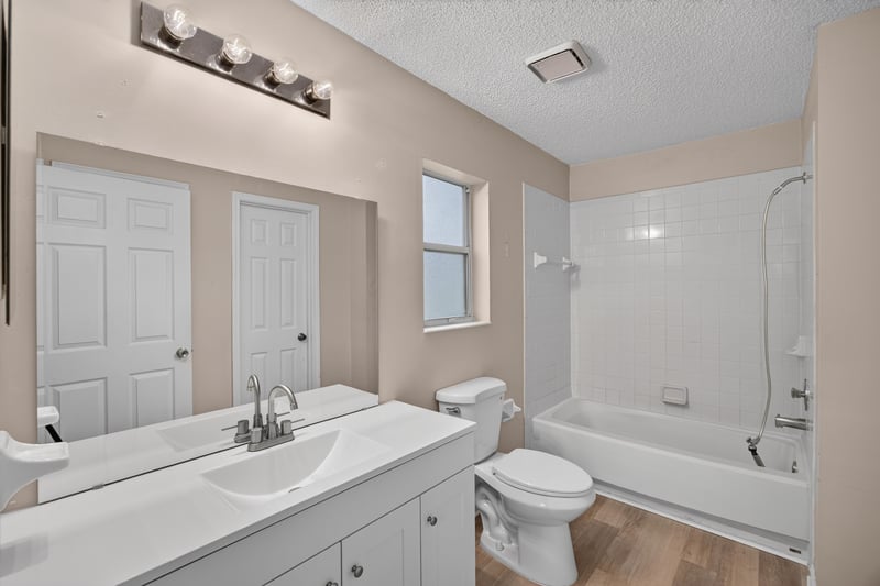 Bathroom with vanity and tub-shower combo at 6646 Shiloh Creek Dr