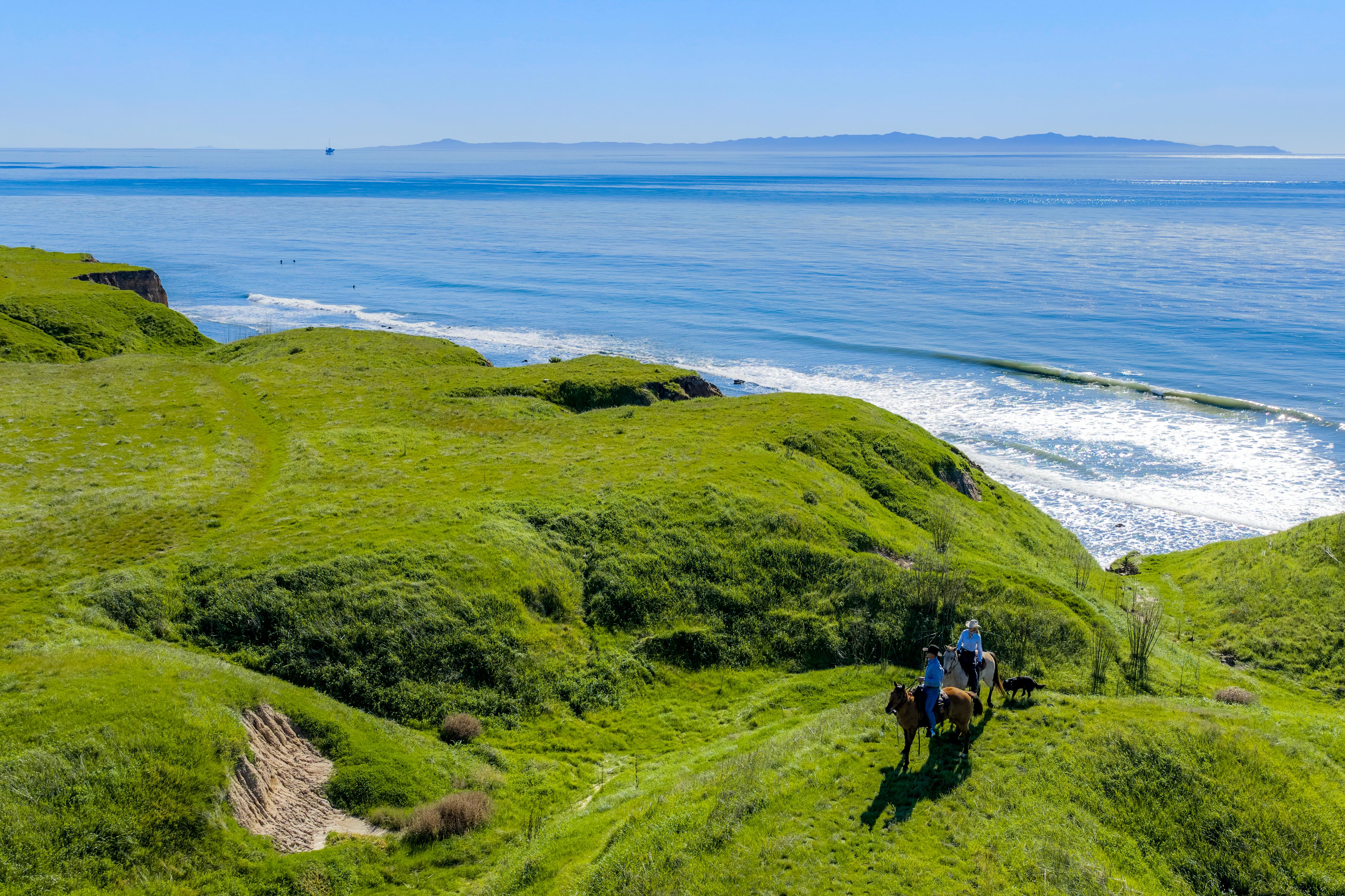 Real estate drone photography elevated perspective of Naples Access Rd, Goleta — Montecito foothills and coastal landscape by VirTour Media