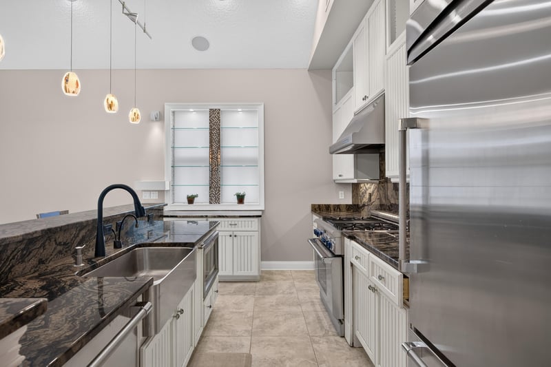 Kitchen sink and stainless appliances at 117 Island Cottage Way, St. Augustine, FL 32080