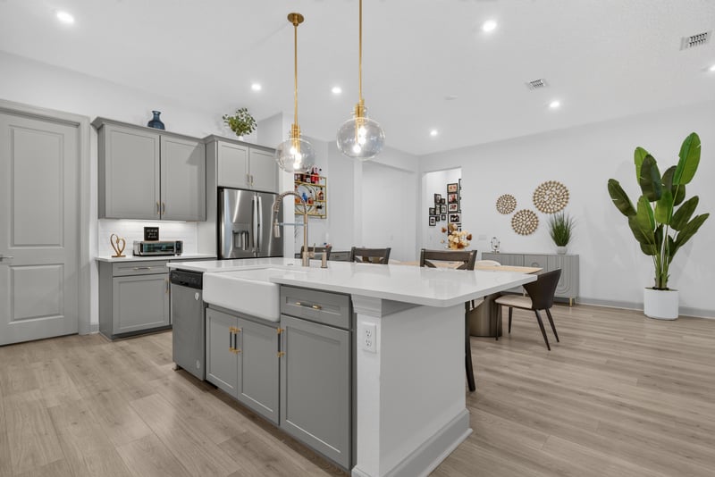 Kitchen island and dining area with pendant lights at 785 Back Creek Dr, St. Augustine, FL 32092