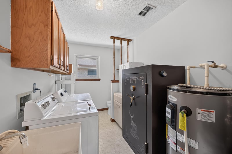 Laundry room with washer, dryer, and floor safe at 2460 San Sago Ln, Jacksonville, FL
