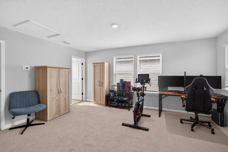 Flex room set up as a home gym and office at 2354 Jennings Farm Dr, Middleburg, FL 32068