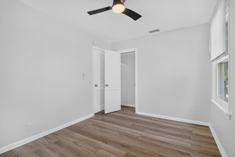 Bedroom with ceiling fan and wood-look flooring at 855 Cornwallis Dr, Jacksonville, FL