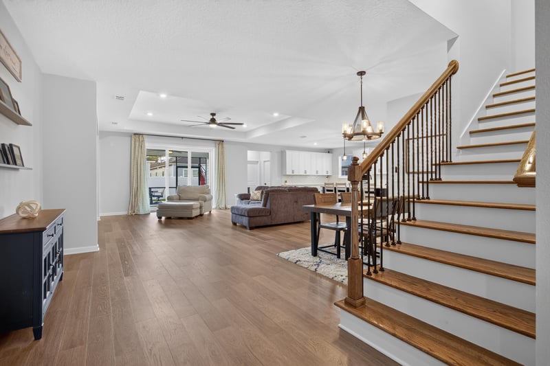 Entry hallway with wood floors leading to the staircase at 2354 Jennings Farm Dr, Middleburg, FL 32068