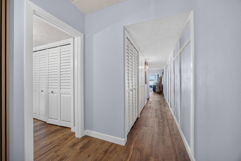 Hallway with wood-look flooring at 2280 Shepard St