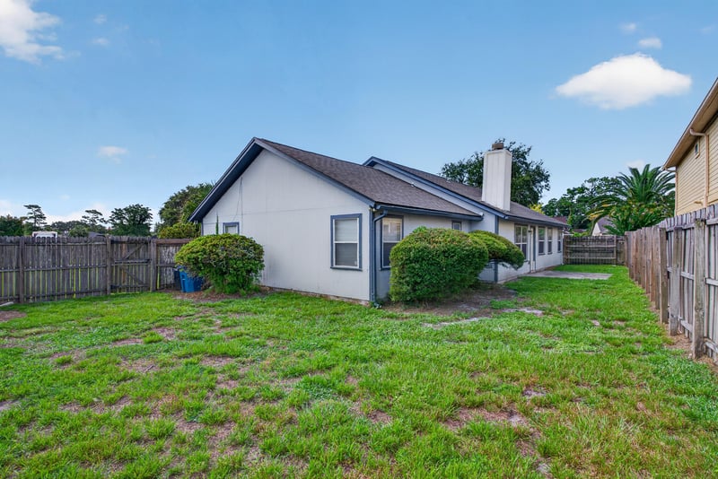 Backyard with open lawn and fence at 400 Ashcroft Landing Dr, Jacksonville, FL 32225