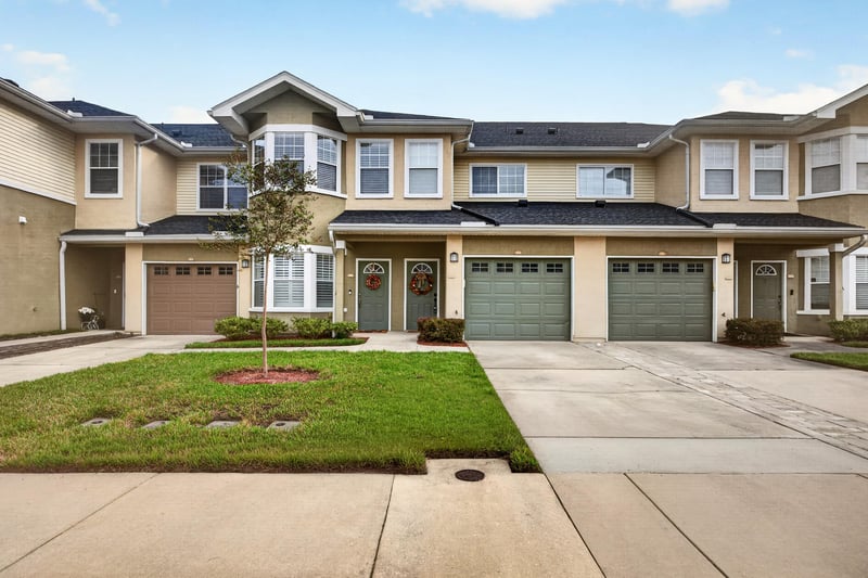 Front exterior with garage and landscaping at 3750 Silver Bluff Blvd, Orange Park, FL