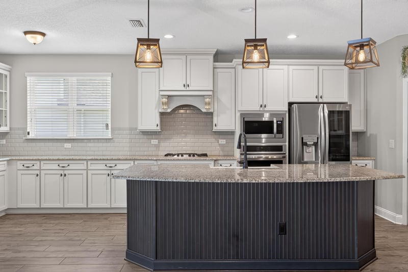 Kitchen with white cabinets and stainless steel appliances at 53 Lumen Ct, St. Augustine, FL 32095