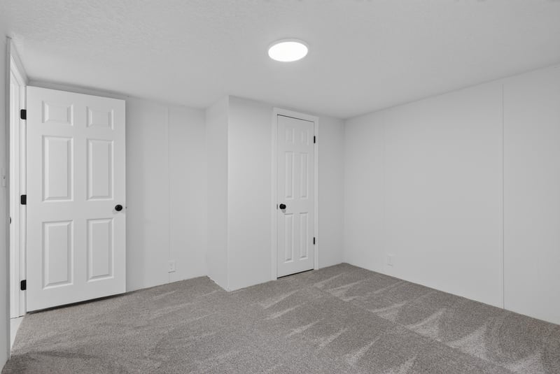 Hallway with carpet and multiple doors at 55520 Jewel-Thomas Rd, Callahan, FL 32011