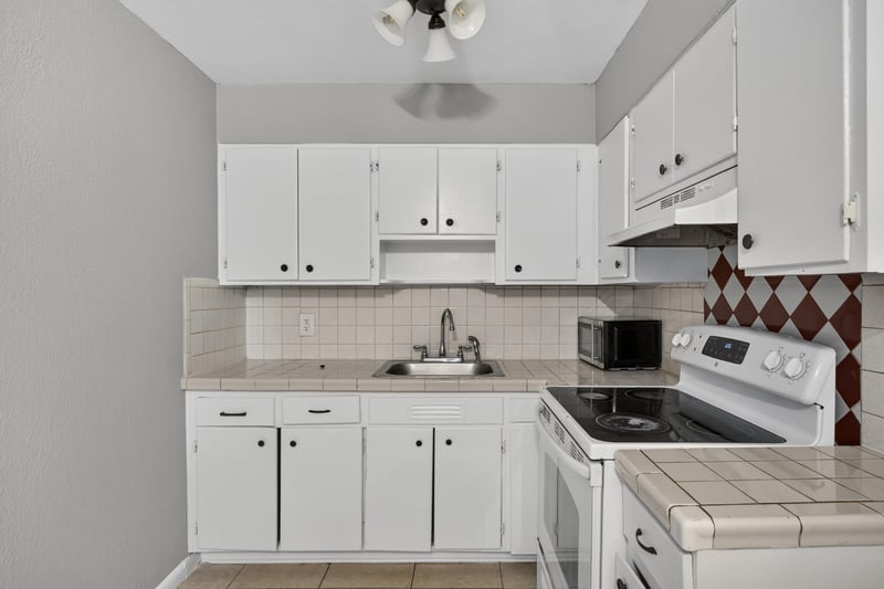 Kitchen close-up of electric range and counter at 4030 Leonard Cir W, Jacksonville, FL 32209
