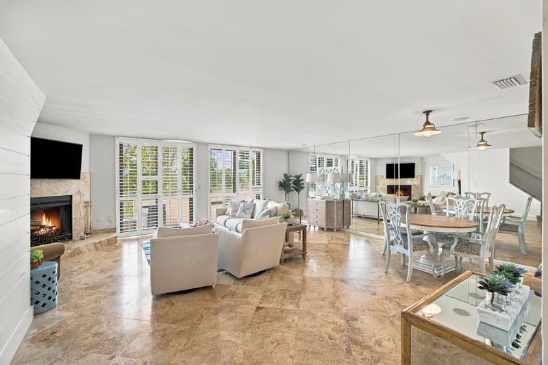 Living room with fireplace and dining area at 752 Spinnakers Reach Dr, Ponte Vedra Beach, FL 32082