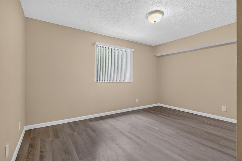 Empty bedroom with window at 5811 Atlantic Blvd unit 47, Jacksonville, FL 32207