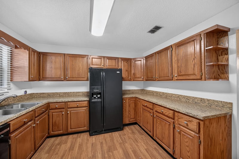 Kitchen with oak cabinetry and side counter at 892 Branscomb Rd, Green Cove Springs, FL