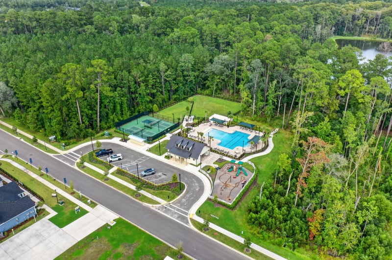 Aerial view of the pool and tennis courts from the street in Middleburg, FL