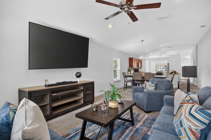 Living room with TV stand and area rug at 9846 Olivia St, Jacksonville, FL
