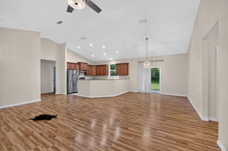 Living room with wood-look floors and ceiling fan at 1012 Fruit Cove Rd, Jacksonville, FL 32259