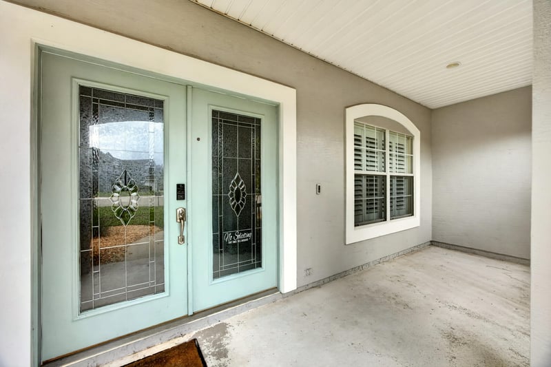Double glass entry doors viewed from the foyer at 1493 Greyfield Dr, St. Augustine, FL 32092