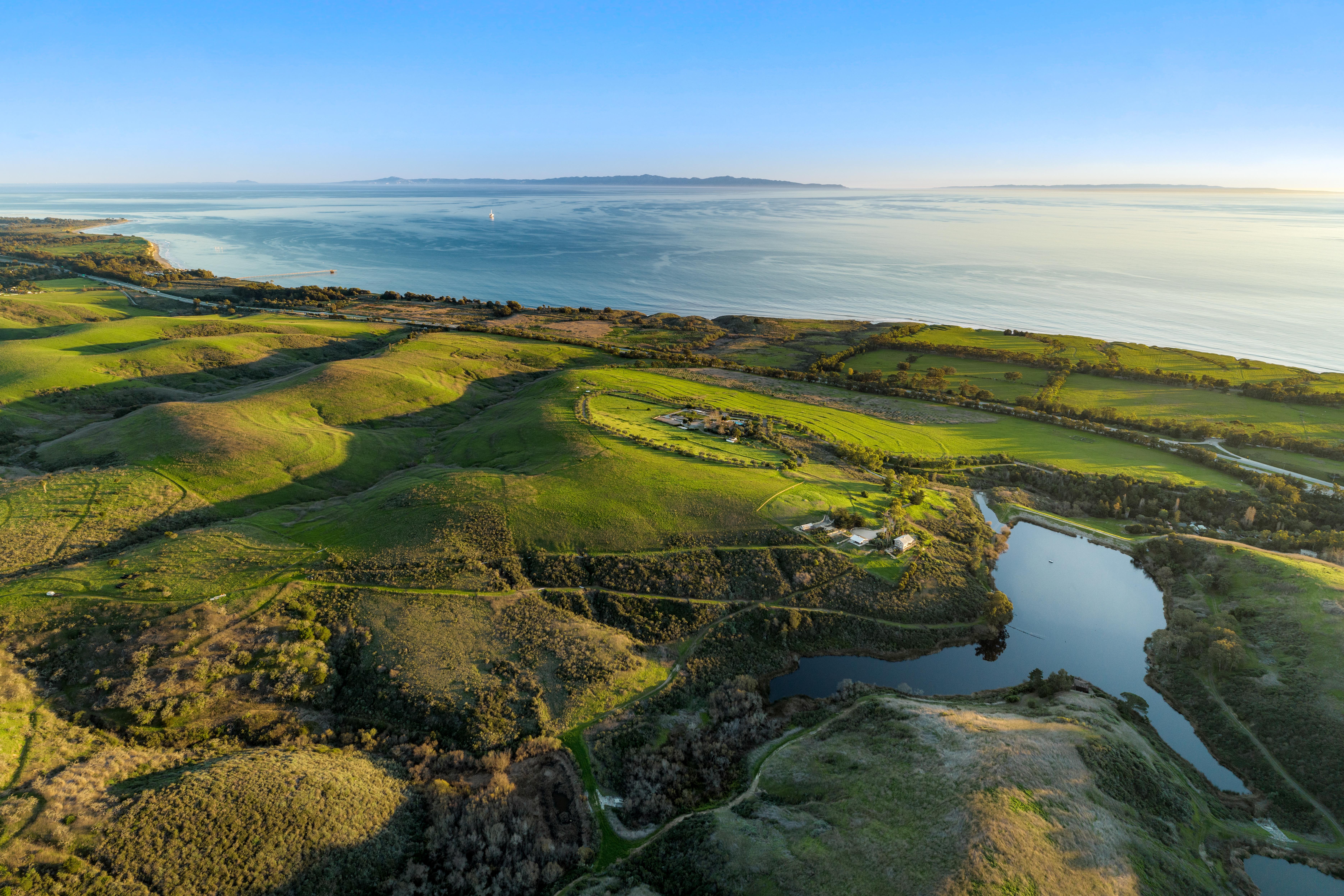 Real estate drone photography elevated perspective of Naples Access Rd, Goleta — Montecito foothills and coastal landscape by VirTour Media