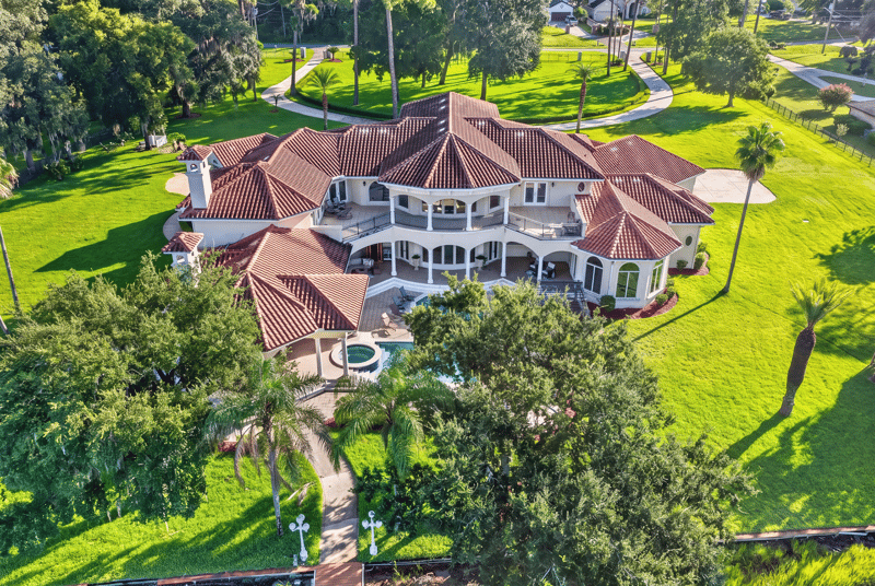 Aerial view of the home with circular drive and lawn at 344 Broward Rd, Jacksonville, FL