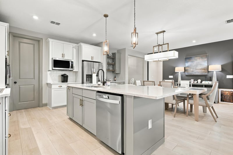 Kitchen island with dishwasher and pendant lighting at 3921 Spyglass Hill Ln