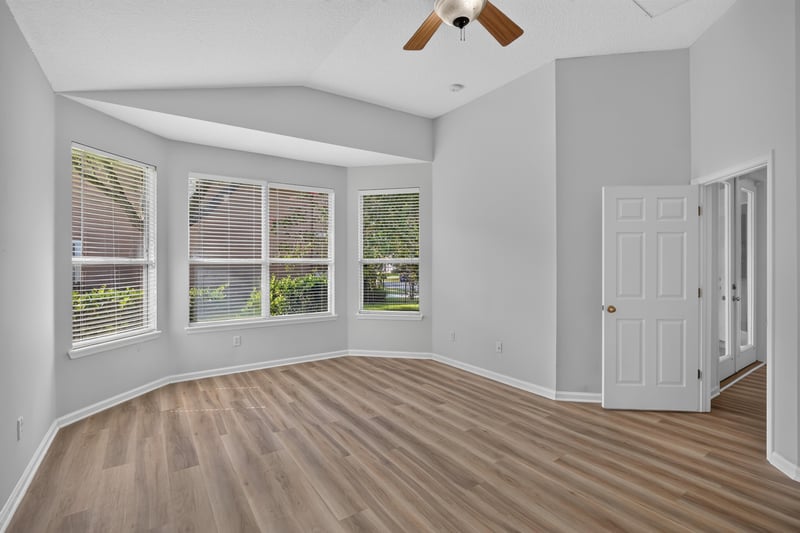 Bedroom with bay window and closet door at 3101 E Banister Rd, St. Augustine, FL 32092