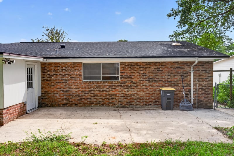 Back exterior with patio at 9954 Larkdale Ct, Jacksonville, FL 32257