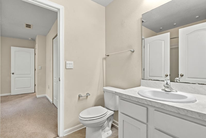 Hallway with carpet and closet doors at 9555 Star Dr, Jacksonville, FL 32256