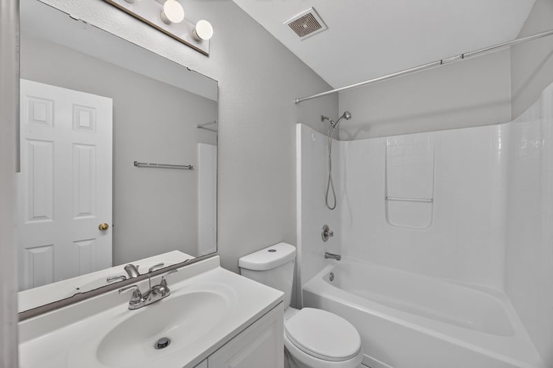Bathroom with tub and shower combo and vanity at 7329 Lawn Tennis Ln, Jacksonville, FL