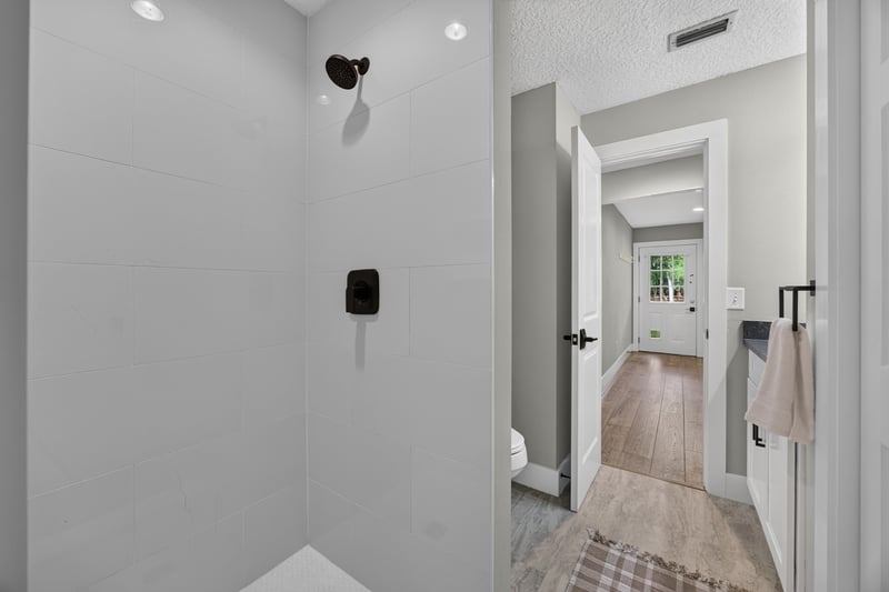 Hallway with shower door visible at 1161 Whispering Pines Rd, Jacksonville, FL 32259