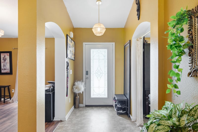Foyer with glass front door and tile flooring at 7392 Timber Falls Ct
