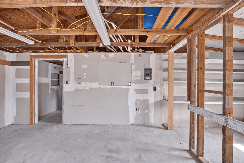 Unfinished room with exposed framing and drywall at 1161 Whispering Pines Rd, Jacksonville, FL 32259